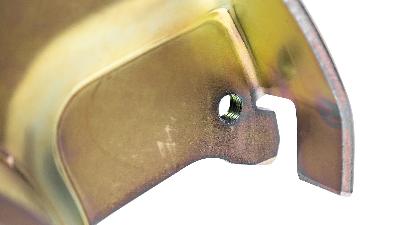 Classic Ford Bronco disc brake conversion caliper mounting bracket closeup.