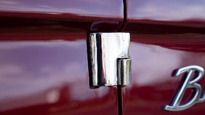 Stainless steel polished early Bronco door hinge installed