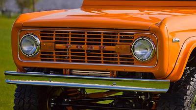 show quality chrome bumper installed on orange ford bronco